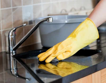Professional home cleaners working in a Hirecarpet living room