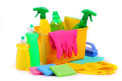 Professional cleaners maintaining an office kitchen and shared workspace in Hirecarpet
